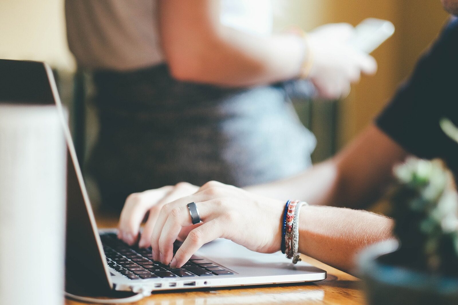 A person typing on a laptop