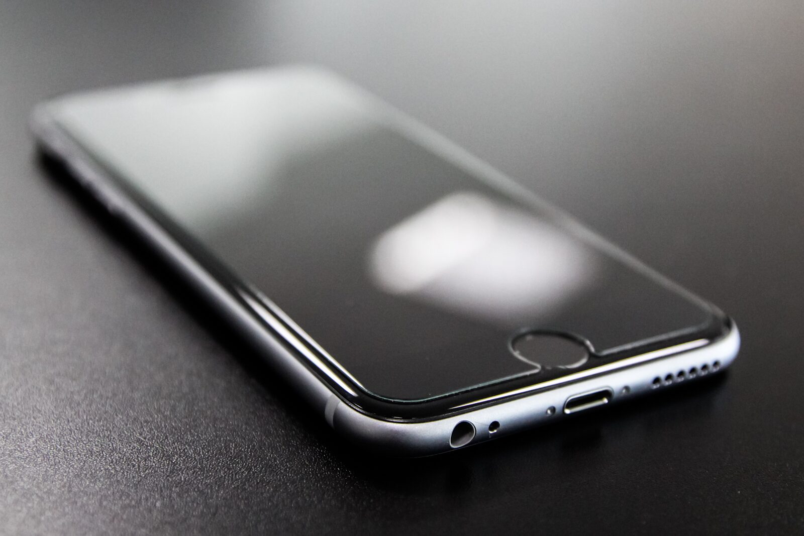 A smartphone resting on a dark surface